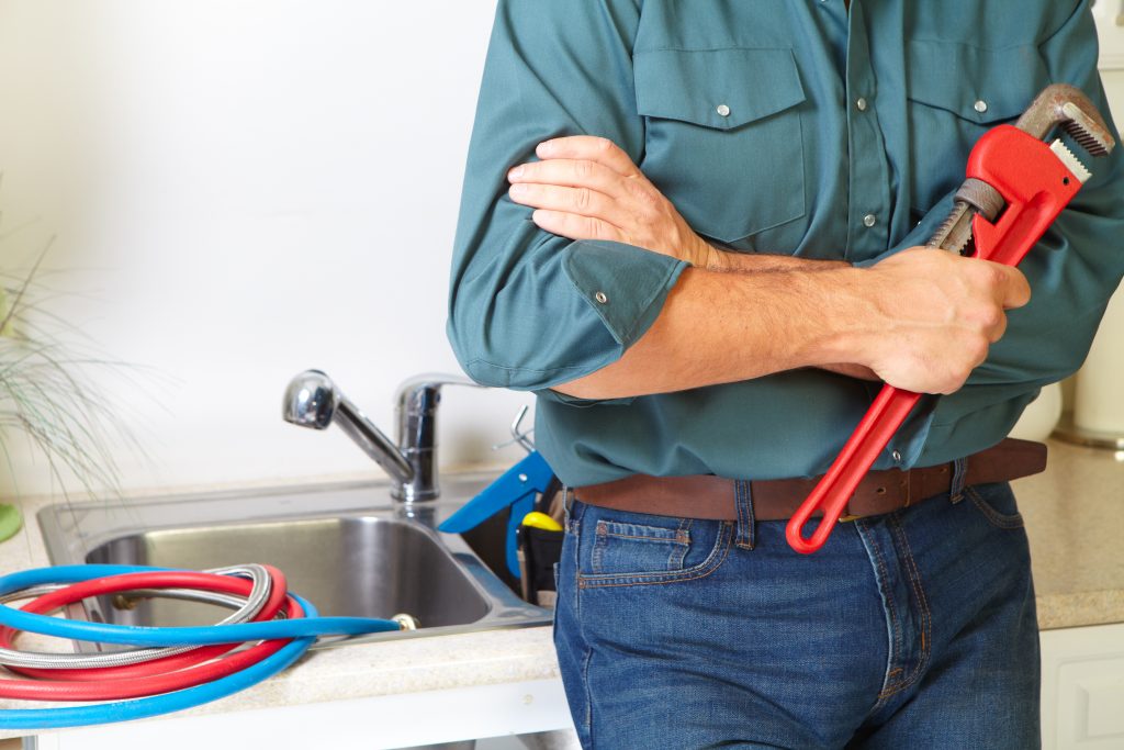 a man getting ready for some drain cleaning 