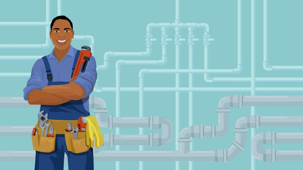 A smiling plumber standing in front of a set of pipes running through the walls of a home